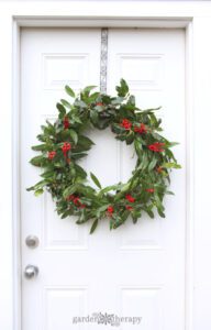 Fresh holly wreath so cheerful for Christmas