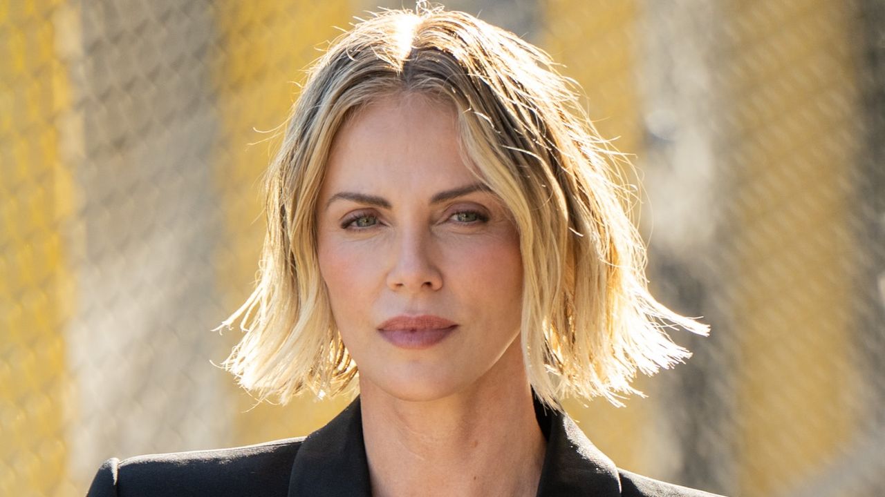 Charlize Theron proves that half-moon manicure is perfect for short nails - see photos