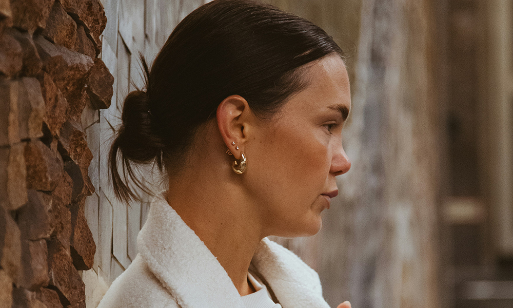 According to estheticians, why wearing earrings on the bed is as bad as putting makeup on the bed?
